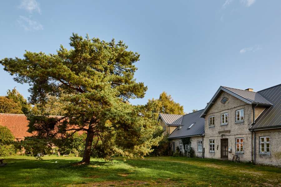 Zooming across the renovated Faxe manor with a new steel roof, Feddet 27, 4640 Faxe, Denmark